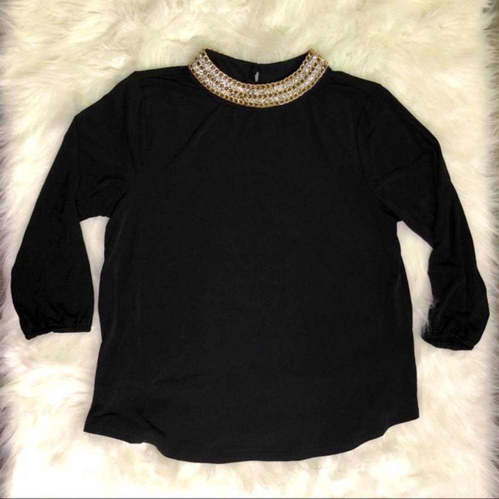 Dark blue long sleeve shirt with necklace on it